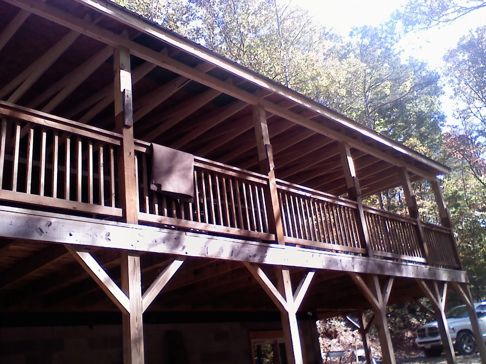 Timber framing under a new elevated porch and deck — Roof Leak Repair in New Site by Roofing Brothers